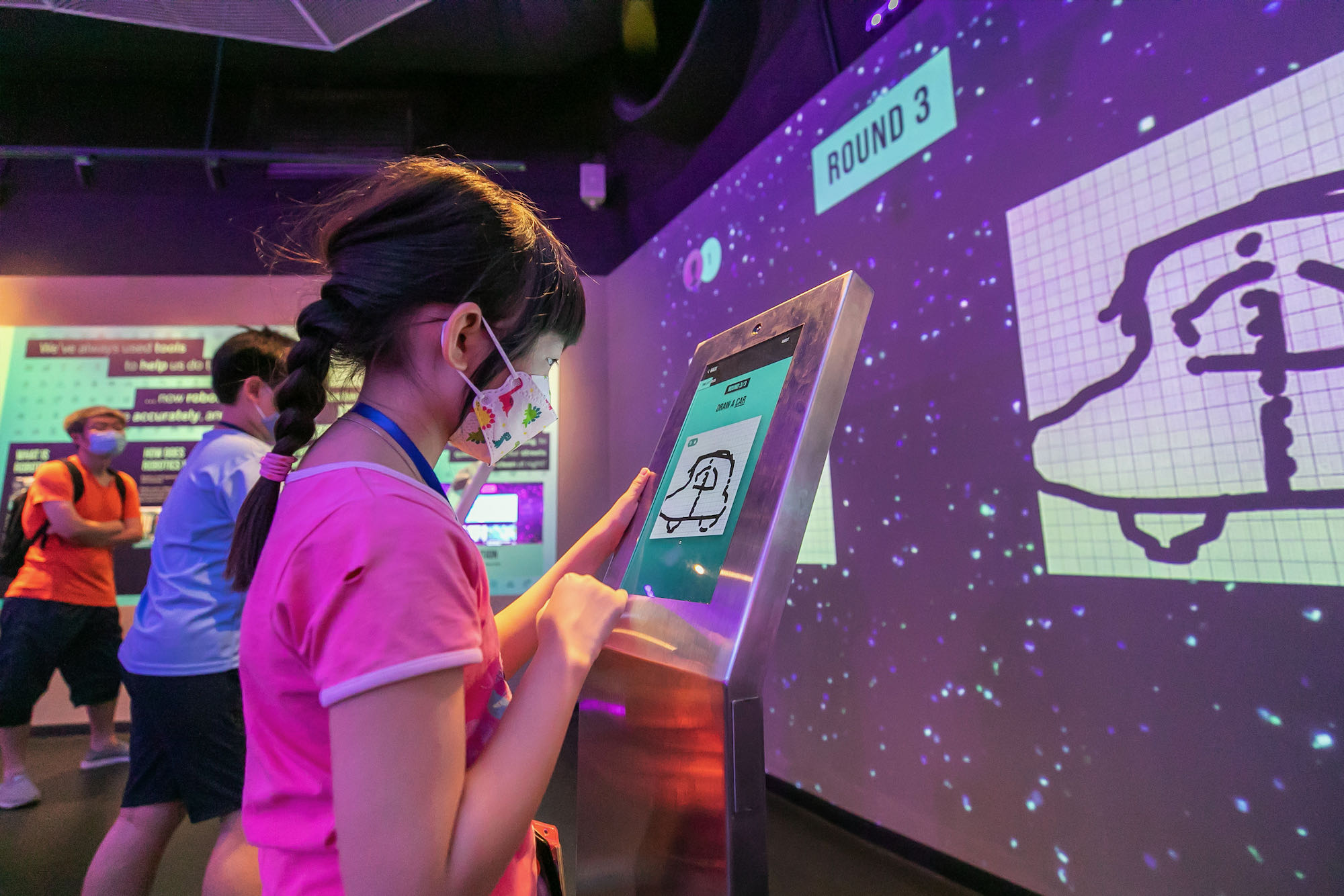 Girl drawing a car doodle on a screen